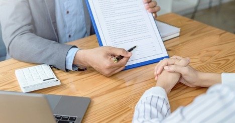 An agent explaining a document to an investor